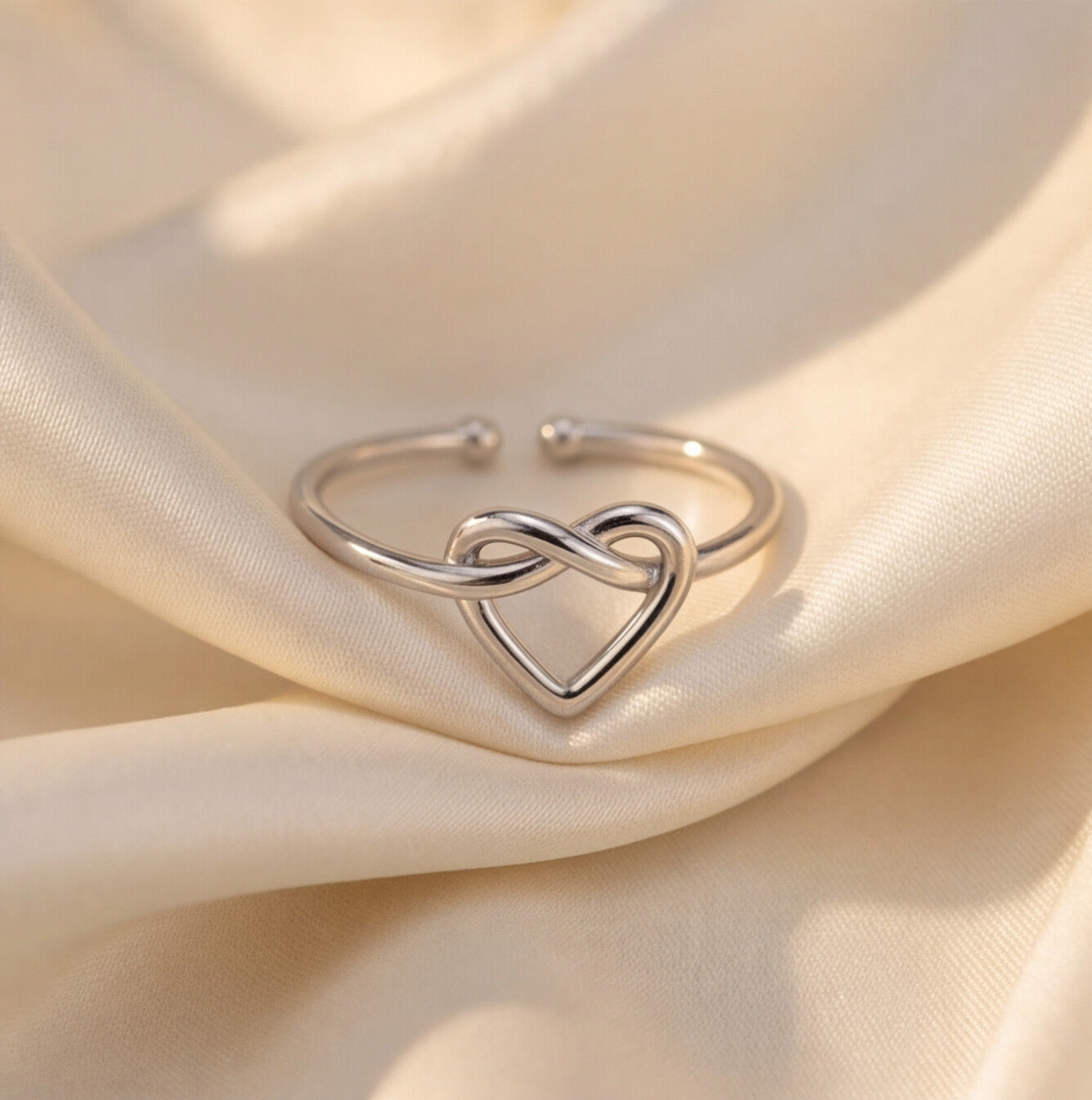 Minimalist twisted heart ring